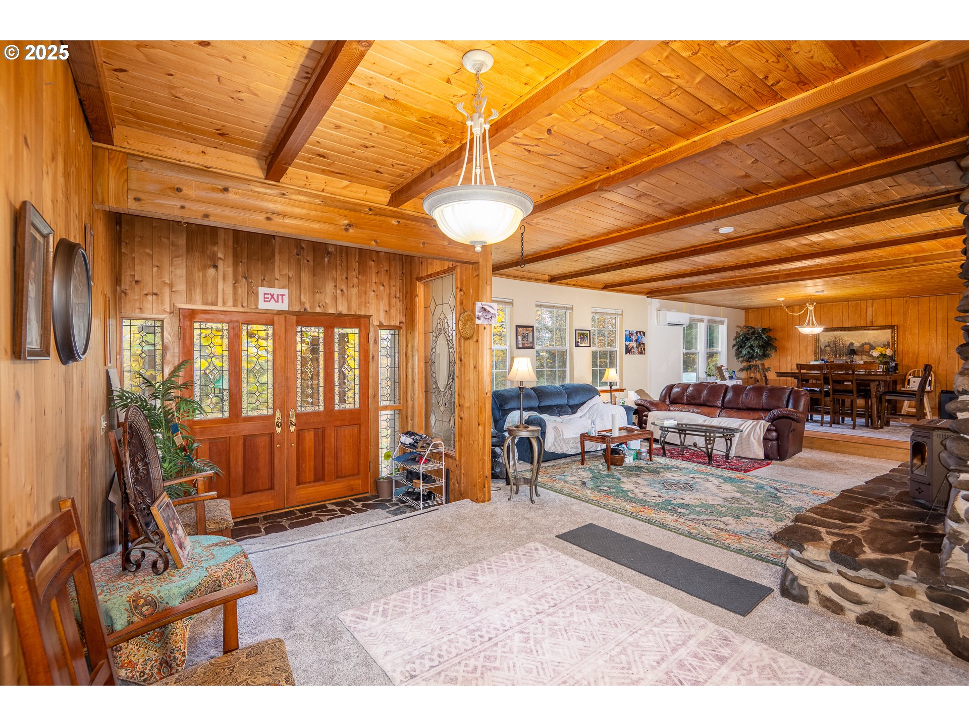 87250 Cedar Flat Road Springfield, OR 97478 - Photo 6 of 48 a living room with patio furniture and a chandelier