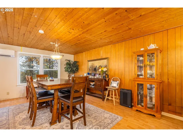 a dining area with a table and chairs