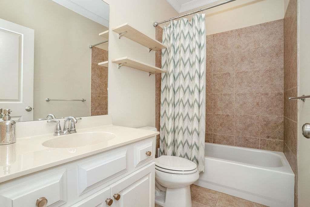 6463 Century Park Place Southeast Mableton, GA 30126 - Photo 27 of 42 a bathroom with a sink a toilet and a bathtub