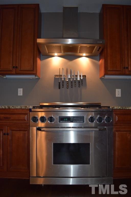 709 East Whitaker Mill Road Raleigh, NC 27608 - Photo 4 of 18 a stove top oven sitting inside of a kitchen