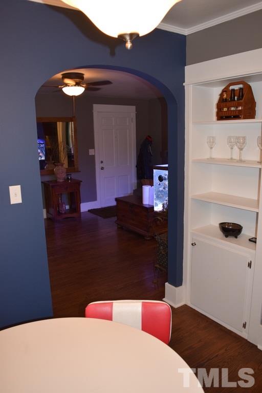 709 East Whitaker Mill Road Raleigh, NC 27608 - Photo 5 of 18 a bedroom with a bed and a dresser