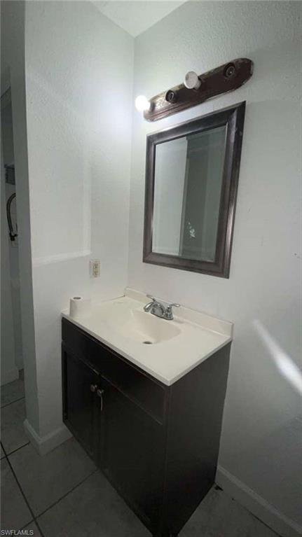 216 Maria Street Fort Myers, FL 33916 - Photo 11 of 19 a bathroom with a sink vanity and mirror