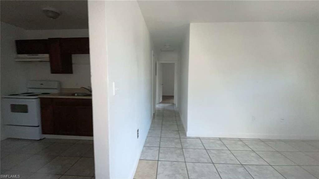 216 Maria Street Fort Myers, FL 33916 - Photo 15 of 19 a view of a kitchen from the hallway
