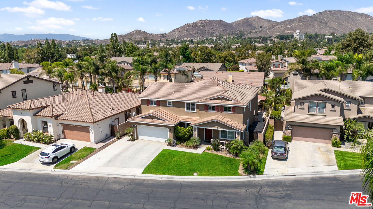 11501 Trailrun Court Riverside, CA 92505 - Photo 44 of 48 a aerial view of a house with a yard and a large tree