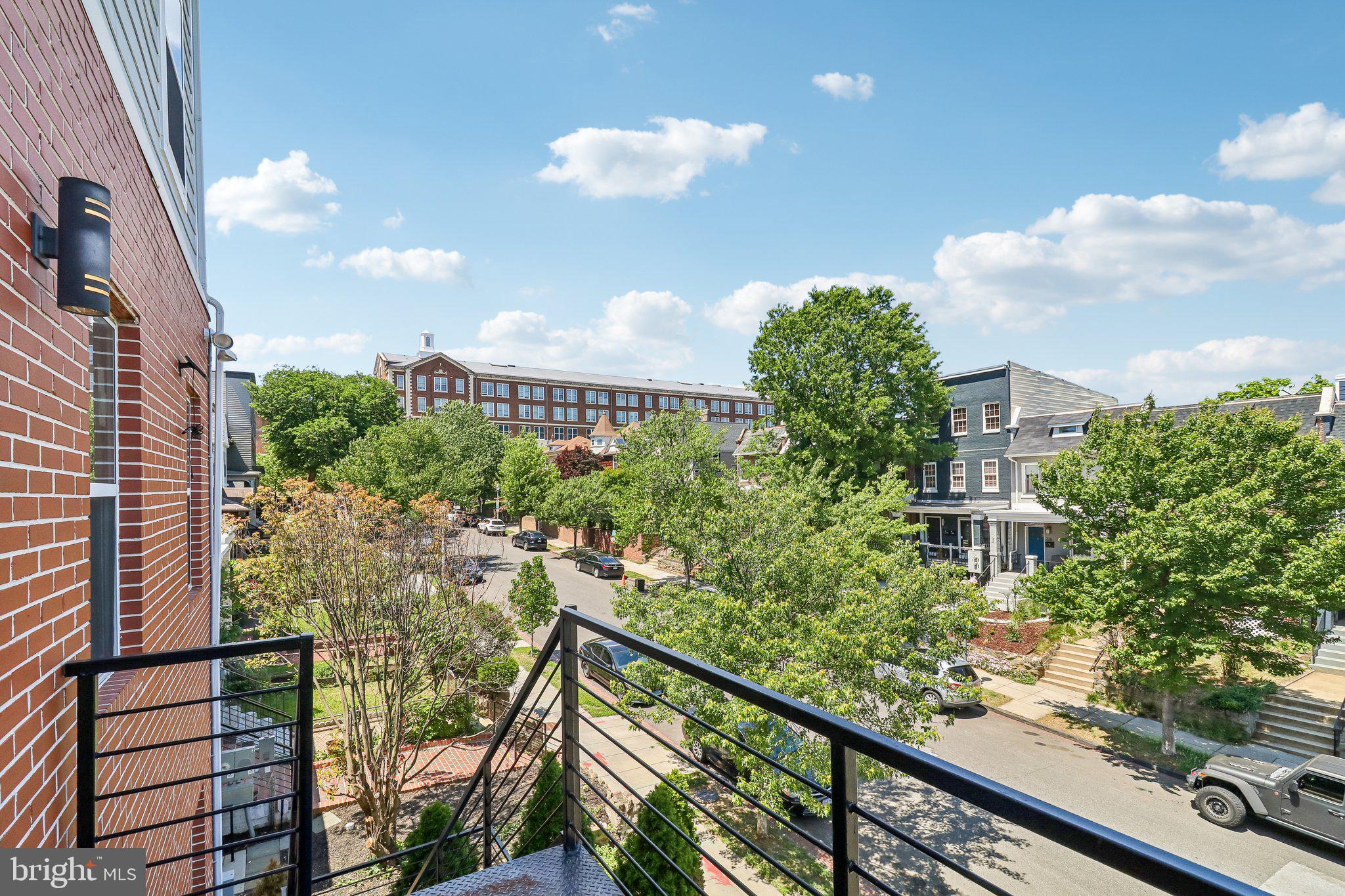 233 S Street Northeast, Unit 5 Washington, DC 20002 - Photo 38 of 41 Sunny balcony view of vibrant street
