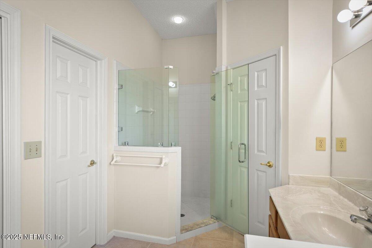 1385 Soaring Flight Way Jacksonville, FL 32225 - Photo 18 of 34 a bathroom with a shower and a sink