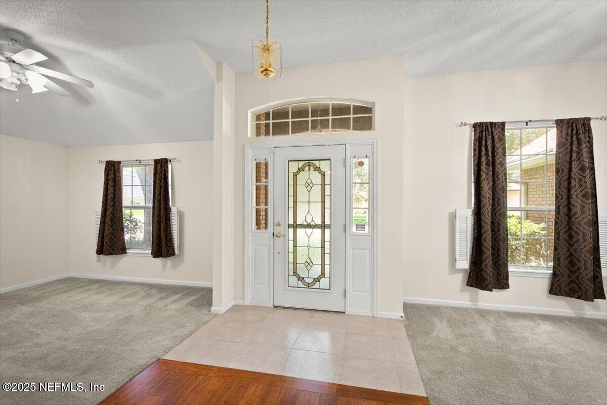 1385 Soaring Flight Way Jacksonville, FL 32225 - Photo 2 of 34 a view of an entryway with wooden floor