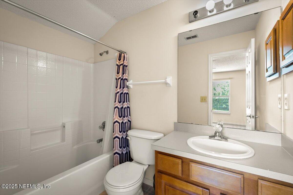 1385 Soaring Flight Way Jacksonville, FL 32225 - Photo 27 of 34 a bathroom with a sink a toilet and shower