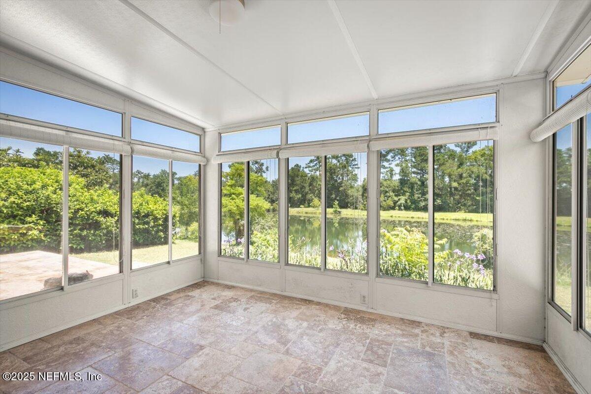 1385 Soaring Flight Way Jacksonville, FL 32225 - Photo 28 of 34 a view of a room with large windows and tree
