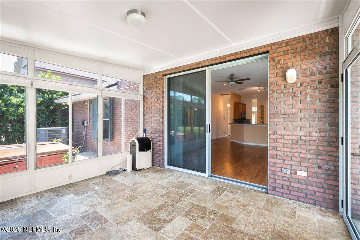 1385 Soaring Flight Way Jacksonville, FL 32225 - Photo 29 of 34 a view of a big room with windows and chandelier