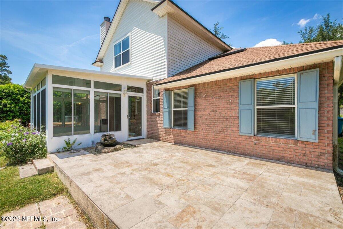 1385 Soaring Flight Way Jacksonville, FL 32225 - Photo 31 of 34 a view of house with yard and glass windows