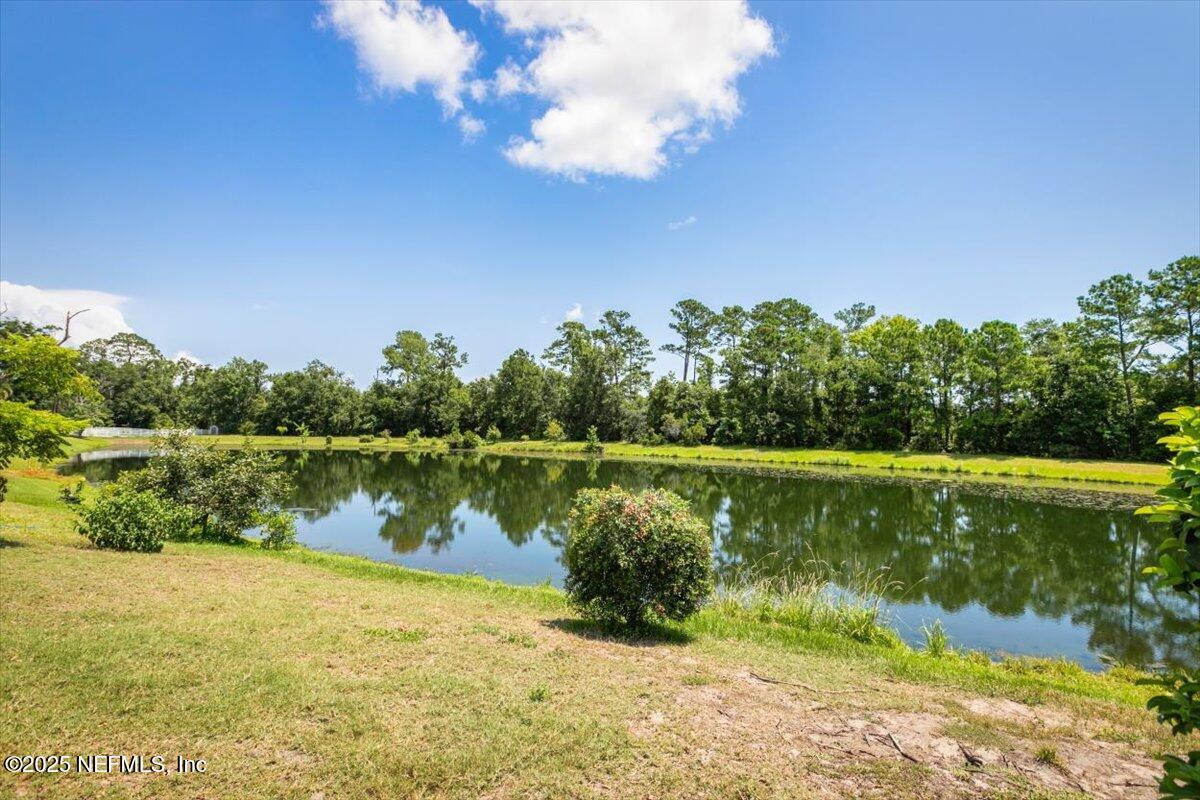 1385 Soaring Flight Way Jacksonville, FL 32225 - Photo 33 of 34 a view of a lake with a yard