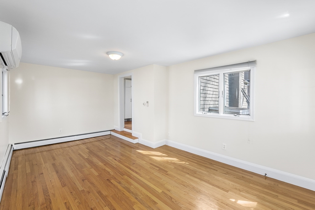 10 Ellison Road Lexington, MA 02421 - Photo 13 of 35 a view of empty room with wooden floor and fan