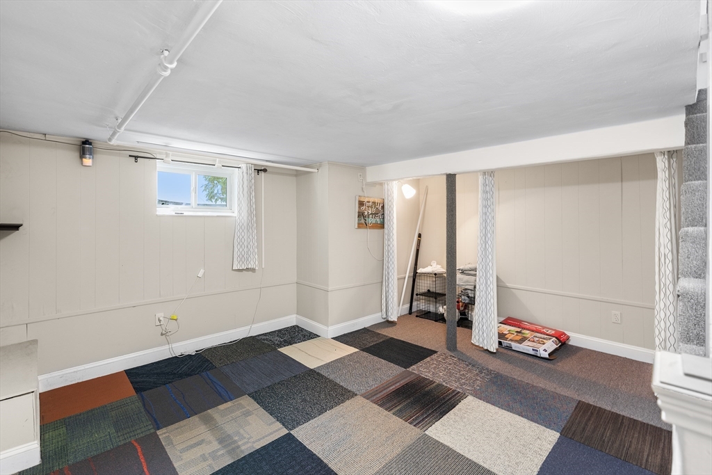 10 Ellison Road Lexington, MA 02421 - Photo 24 of 35 a room with a couch and a rug
