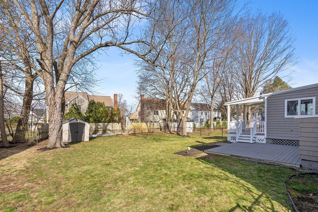 10 Ellison Road Lexington, MA 02421 - Photo 29 of 35 a view of a yard with a large tree