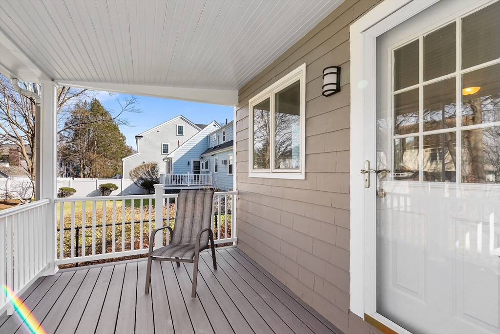 10 Ellison Road Lexington, MA 02421 - Photo 3 of 35 a view of balcony with furniture and wooden floor