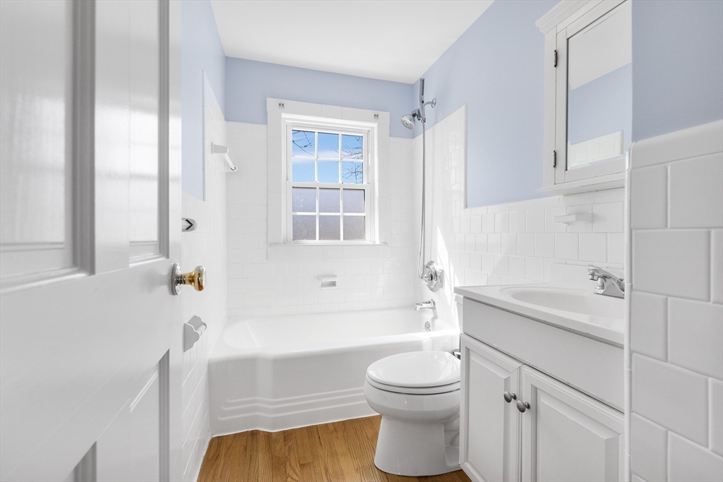 10 Ellison Road Lexington, MA 02421 - Photo 9 of 35 a bathroom with a toilet a sink and bathtub