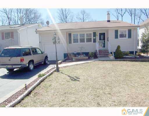 33 Highland Road Colonia, NJ 07067 - Photo 1 of 10 a view of a house with backyard and sitting area