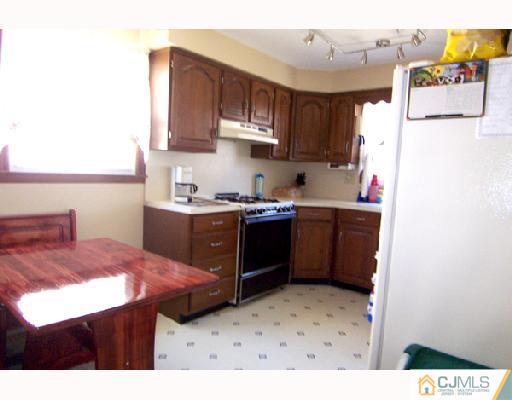 33 Highland Road Colonia, NJ 07067 - Photo 2 of 10 a kitchen with a sink and cabinets