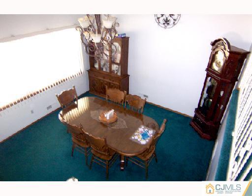 33 Highland Road Colonia, NJ 07067 - Photo 6 of 10 a view of a dining room with furniture and wooden floor