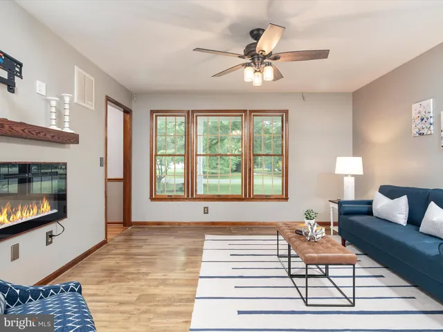 a living room with a couch and a dining table