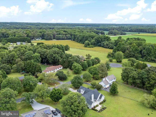an aerial view of a houses with outdoor space and street view