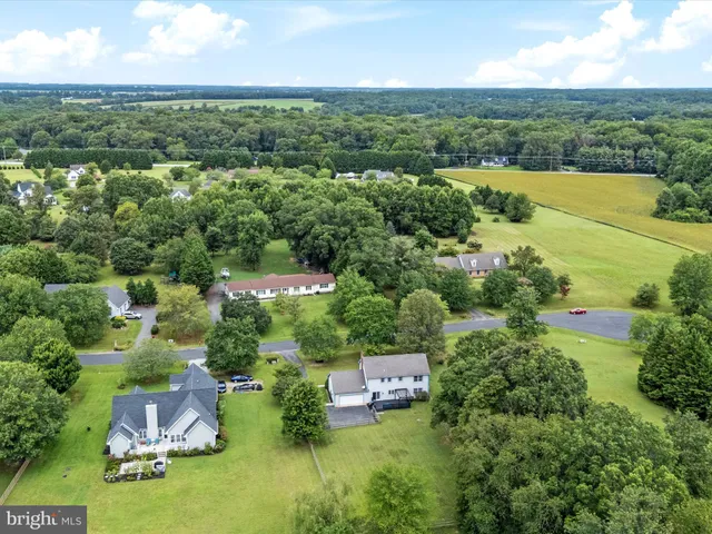 an aerial view of a houses with a lake view