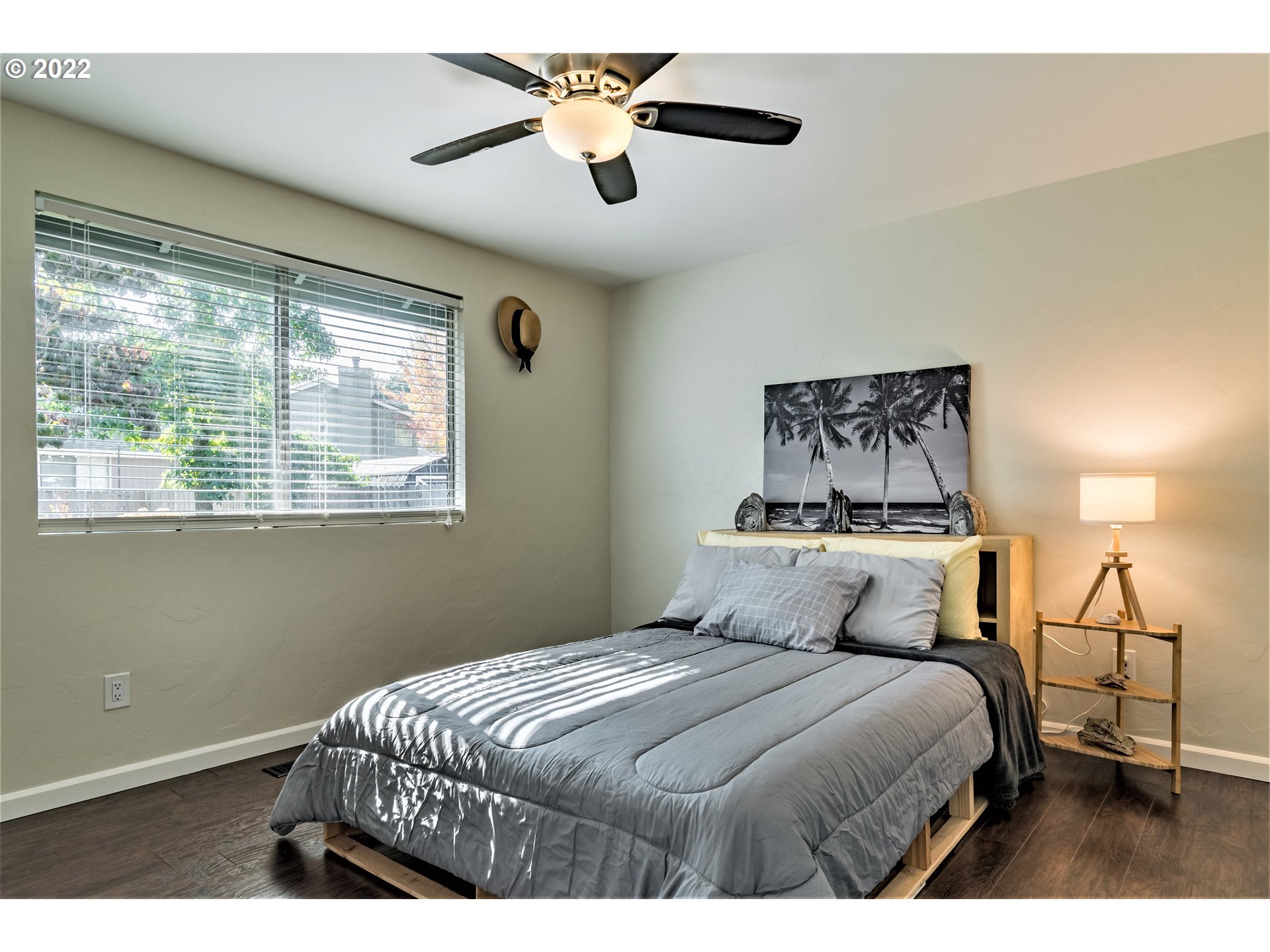 4467 Holly Street Springfield, OR 97478 - Photo 12 of 32 a bedroom with a large bed and a chandelier