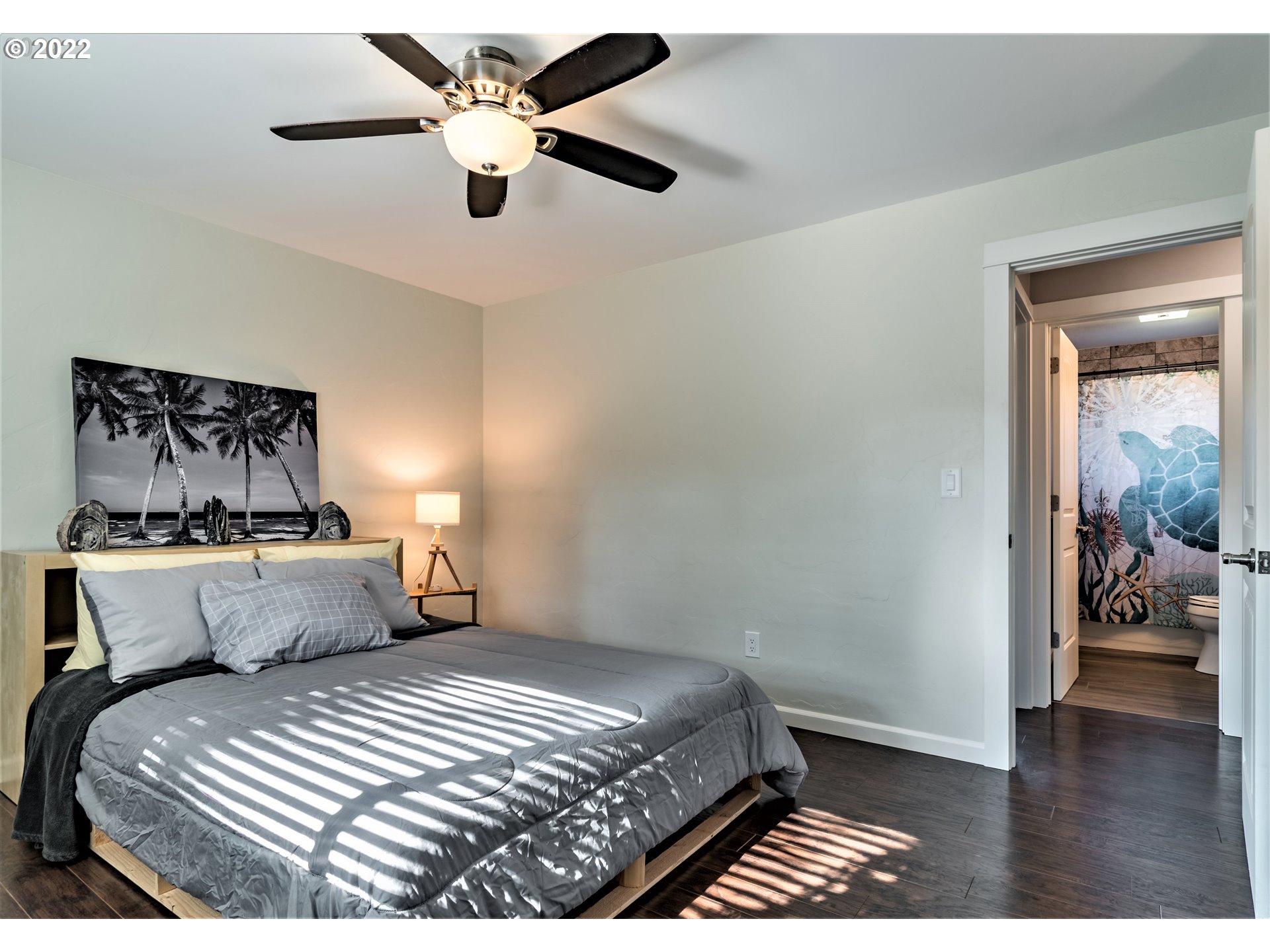 4467 Holly Street Springfield, OR 97478 - Photo 13 of 32 a bedroom with a bed and a chandelier