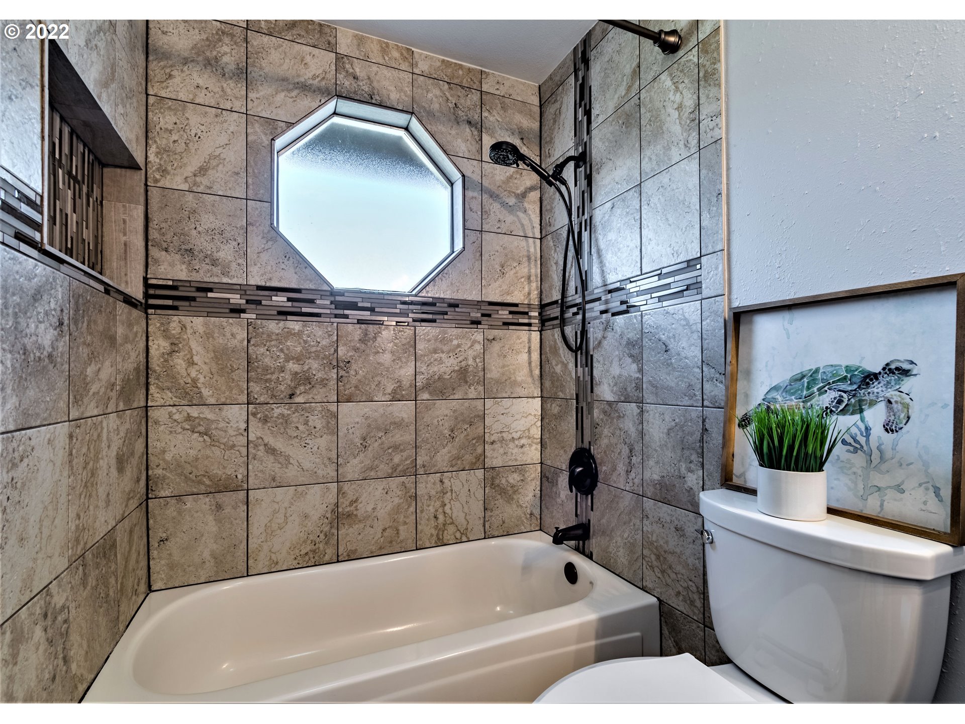 4467 Holly Street Springfield, OR 97478 - Photo 15 of 32 a bathroom with a toilet and a bathtub