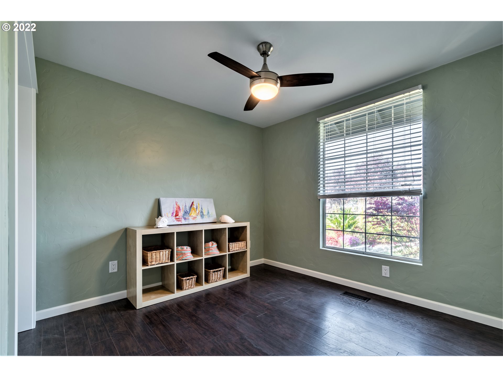 4467 Holly Street Springfield, OR 97478 - Photo 16 of 32 a view of a livingroom with a hardwood floor and a ceiling fan