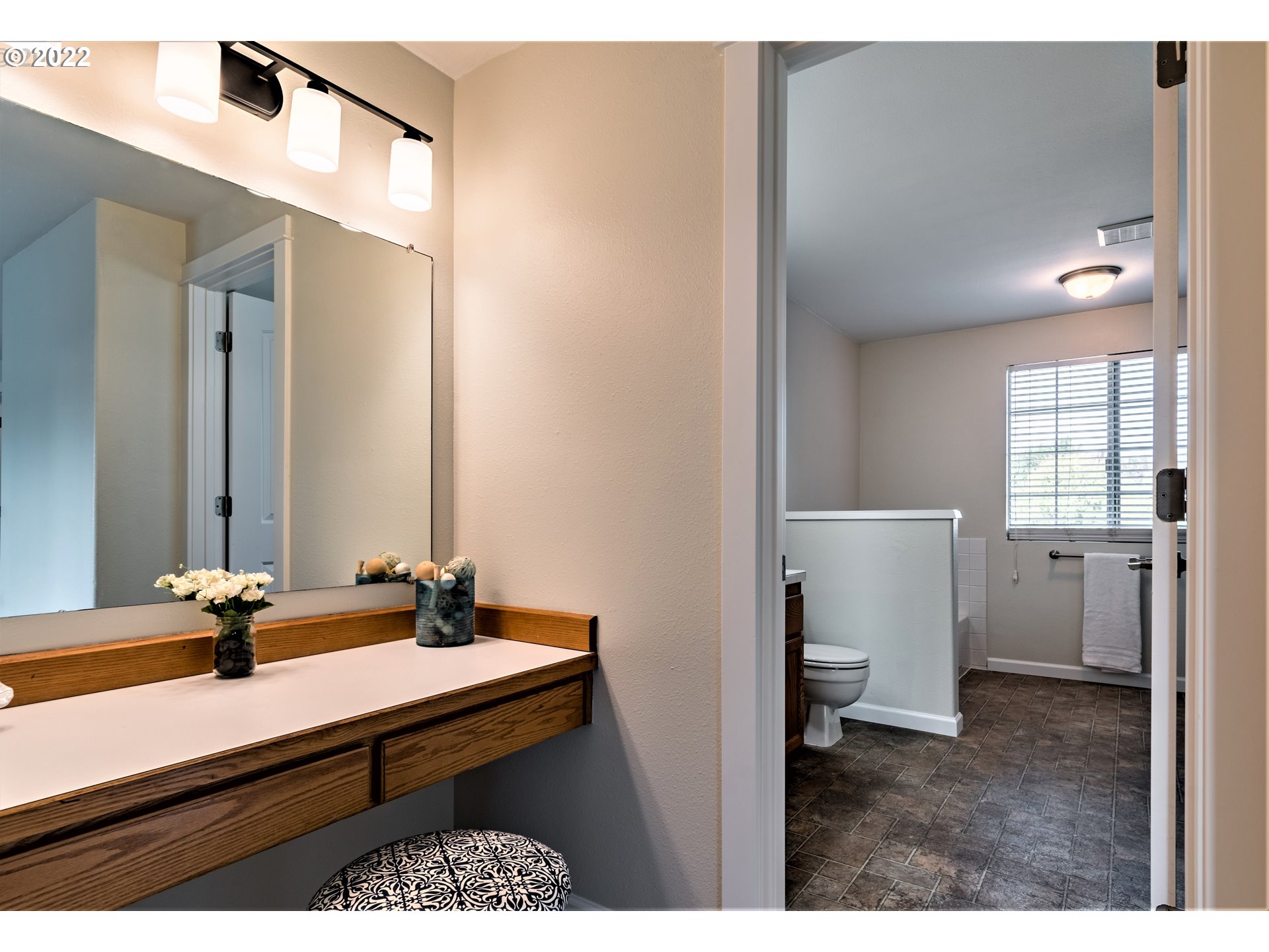 4467 Holly Street Springfield, OR 97478 - Photo 22 of 32 a bathroom with a sink a light fixture and a toilet