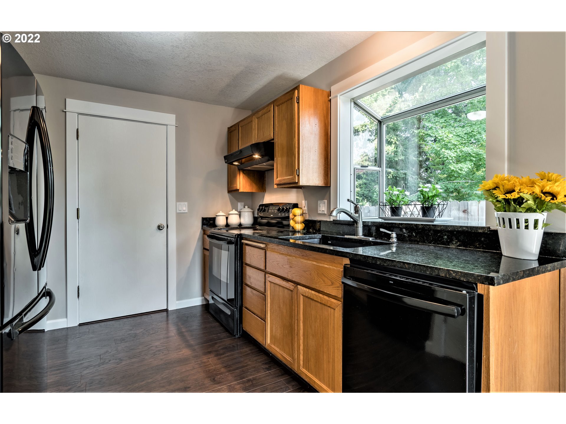 4467 Holly Street Springfield, OR 97478 - Photo 8 of 32 a kitchen with stainless steel appliances a sink stove and refrigerator