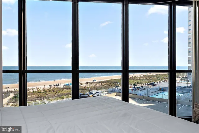 a view of an empty room and a floor to ceiling window