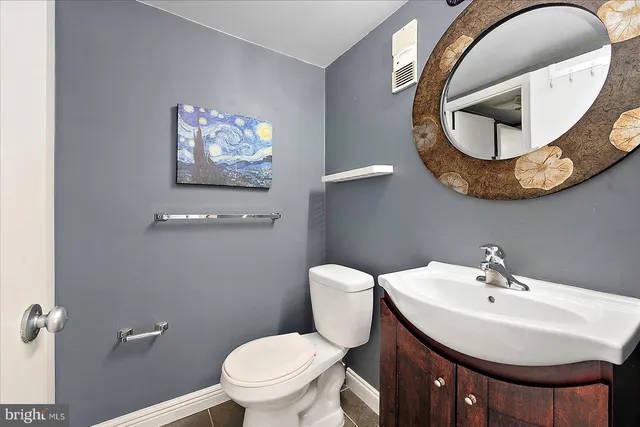 a bathroom with a sink and mirror