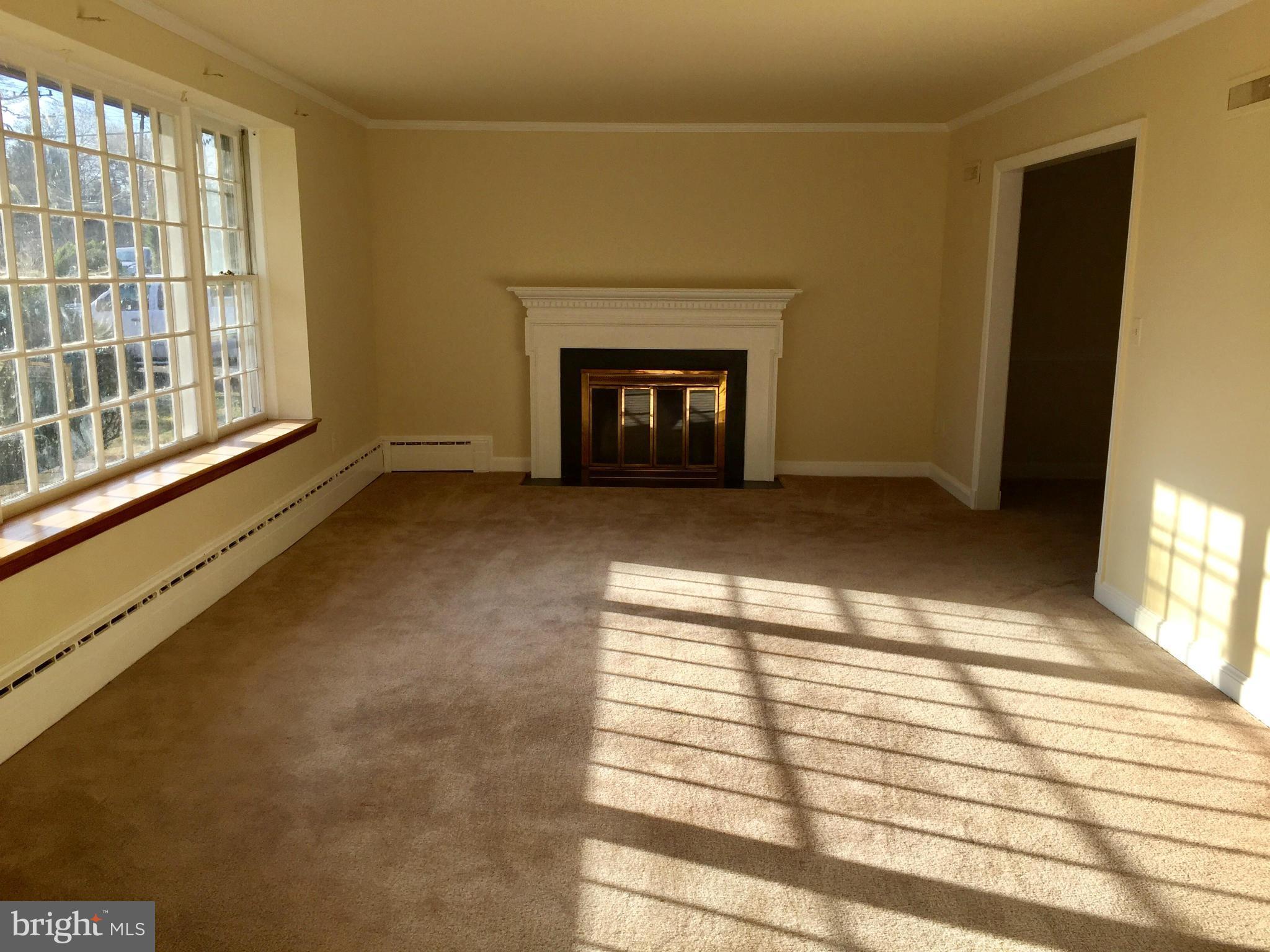 9424 Seven Locks Road Bethesda, MD 20817 - Photo 5 of 30 a view of an empty room with glass door and a window