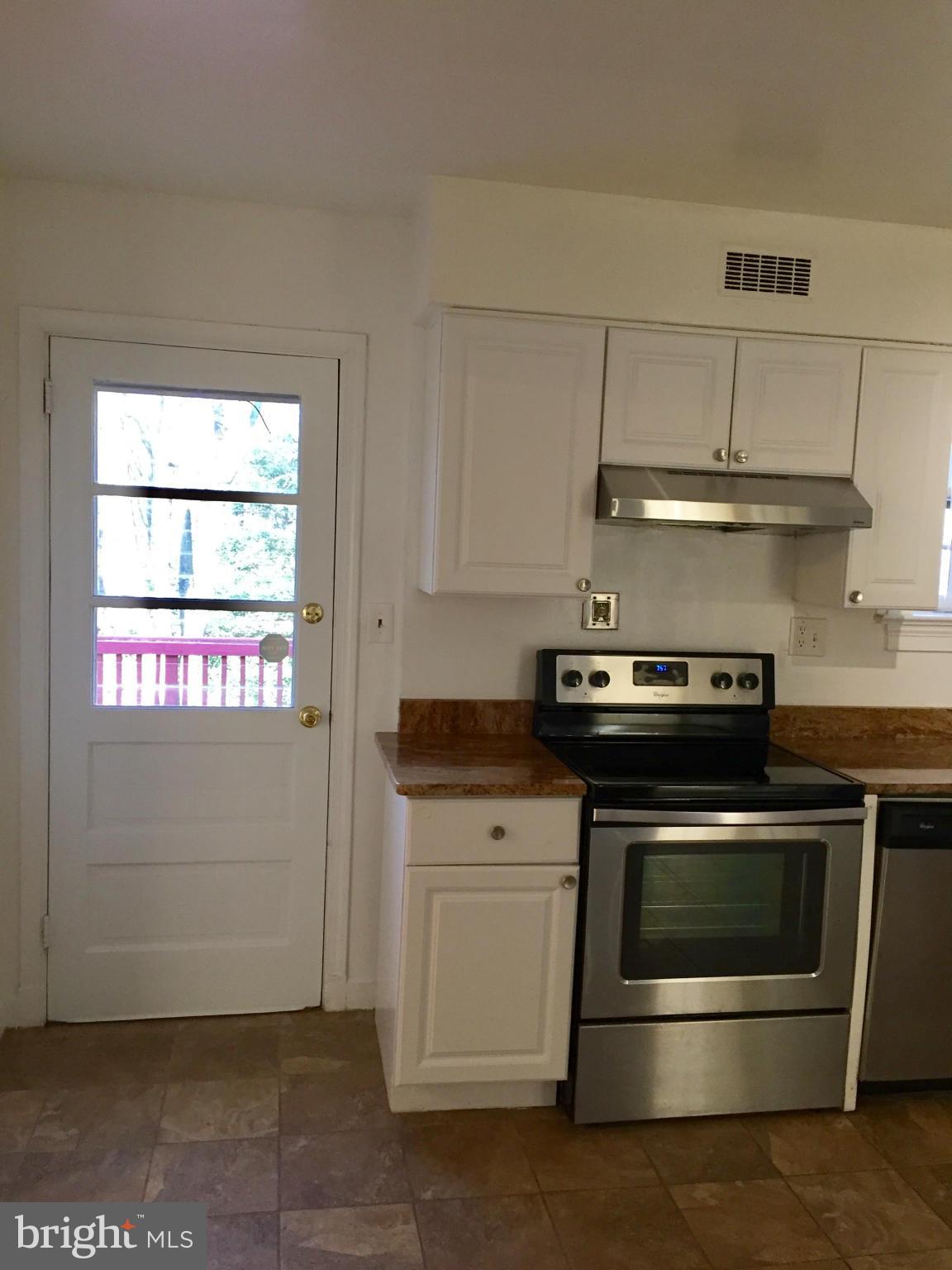 9424 Seven Locks Road Bethesda, MD 20817 - Photo 8 of 30 a stove top oven sitting inside of a kitchen