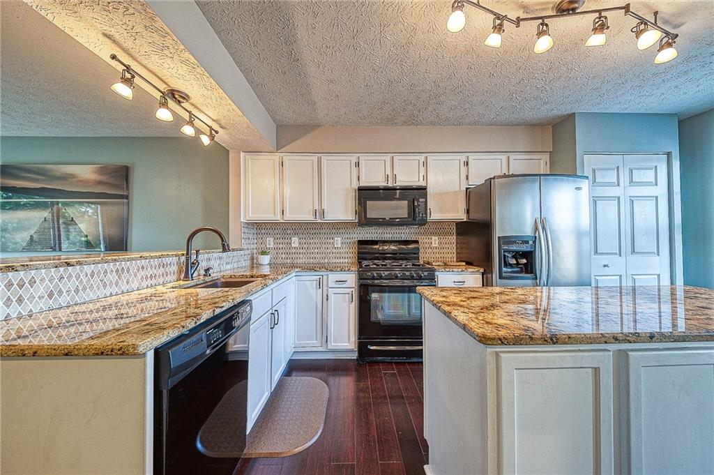 110 Lockheed Drive Coraopolis, PA 15108 - Photo 3 of 42 The kitchen's granite countertops, kitchen island, and eat-in counter make for a functional and stylish cooking space. The kitchen also features a pantry for additional storage.