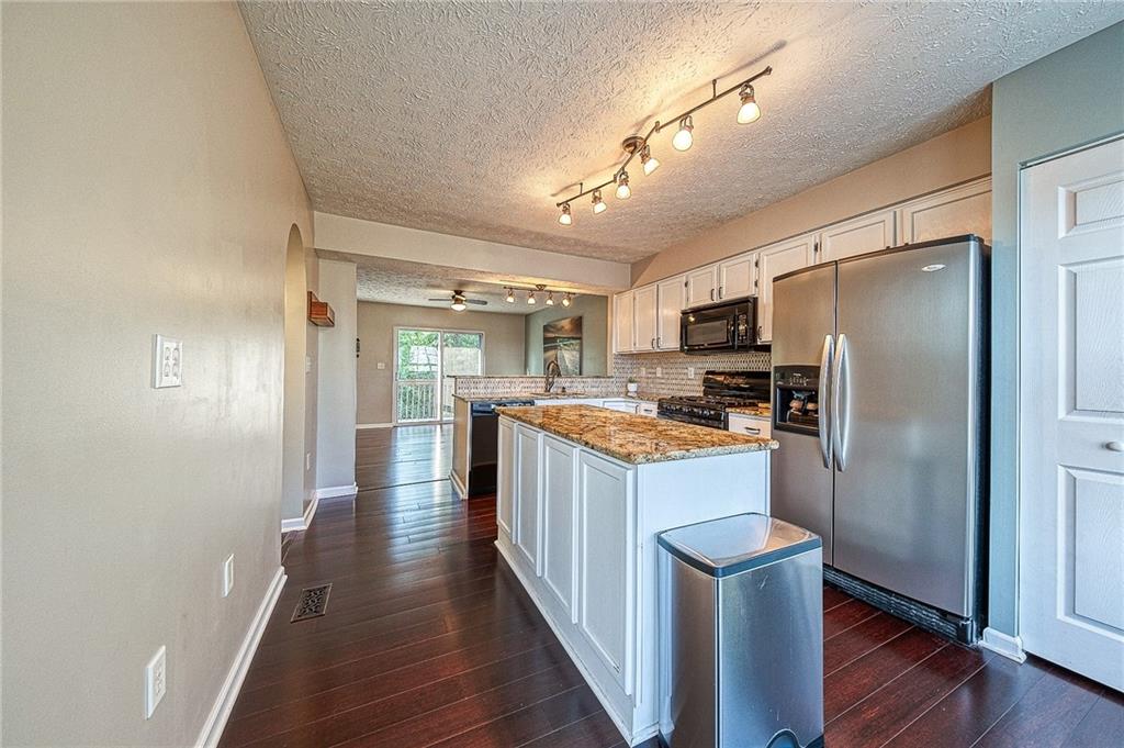110 Lockheed Drive Coraopolis, PA 15108 - Photo 5 of 42 Breakfast bar into the dining room makes entertaining guests a breeze!