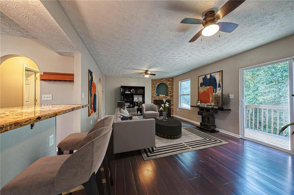 110 Lockheed Drive Coraopolis, PA 15108 - Photo 8 of 42 The upgraded open floor plan features a spacious living room with a gas fireplace and large windows that draw in natural light, perfect for relaxation and entertaining.