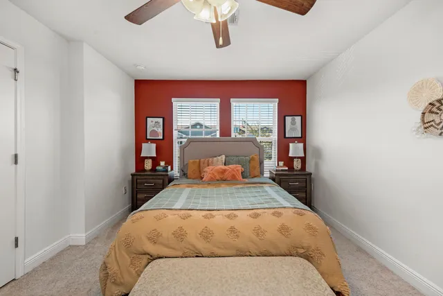 a bedroom with a bed and window