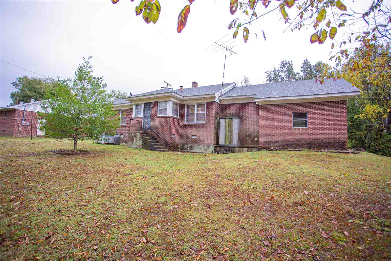 225 Anthony Street Ripley, TN 38063 - Photo 17 of 19 a view of a house with a backyard