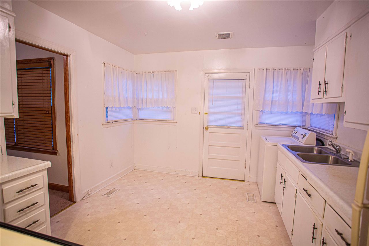225 Anthony Street Ripley, TN 38063 - Photo 6 of 19 a kitchen with a sink stove and cabinets