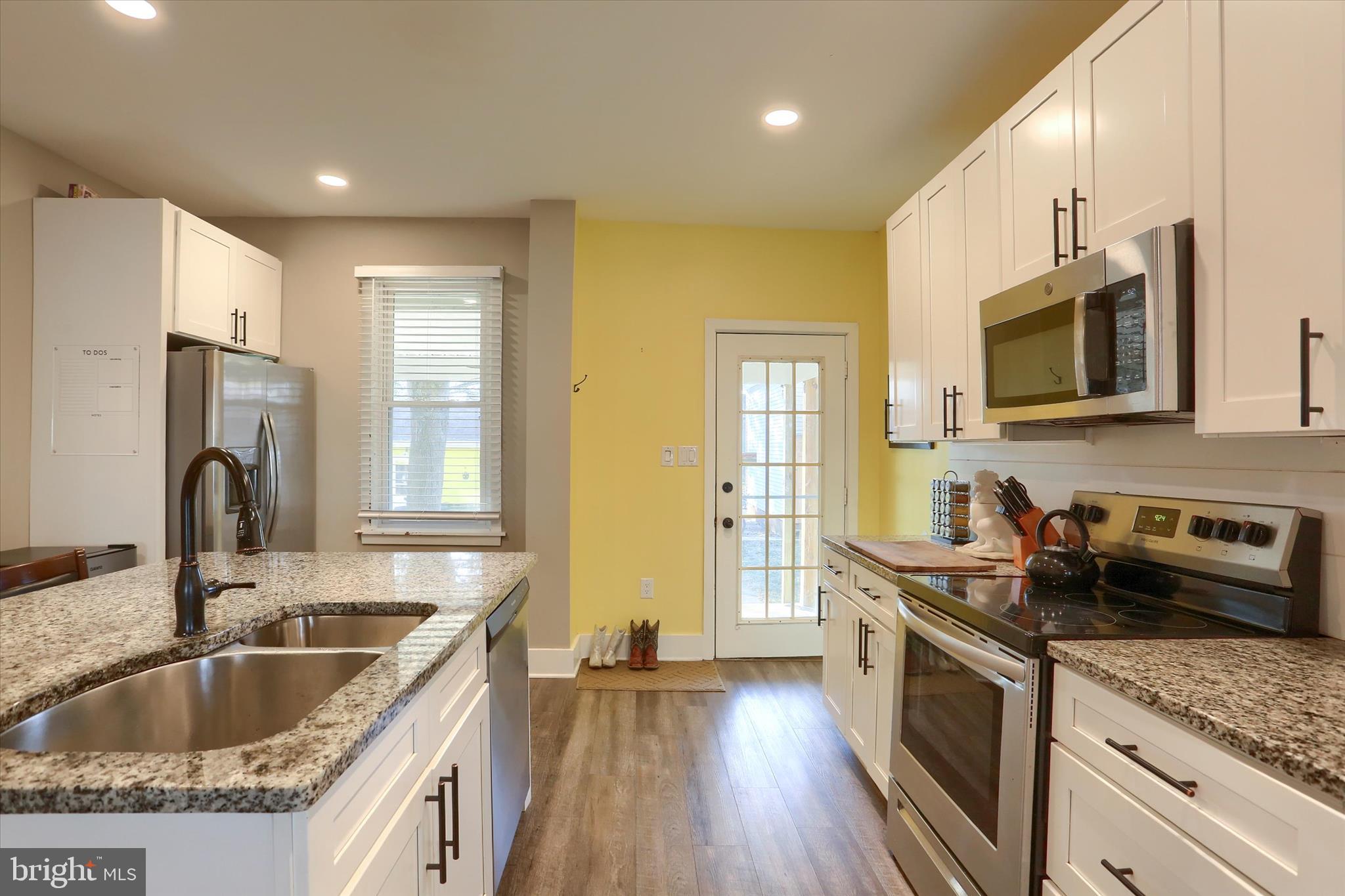 1544 Lafayette Street Lebanon, PA 17042 - Photo 15 of 49 a kitchen with stainless steel appliances granite countertop a sink stove and refrigerator