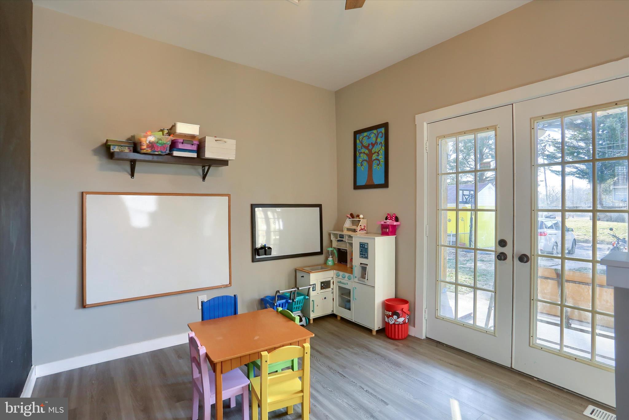 1544 Lafayette Street Lebanon, PA 17042 - Photo 17 of 49 a living room with furniture a flat screen tv and a floor to ceiling window