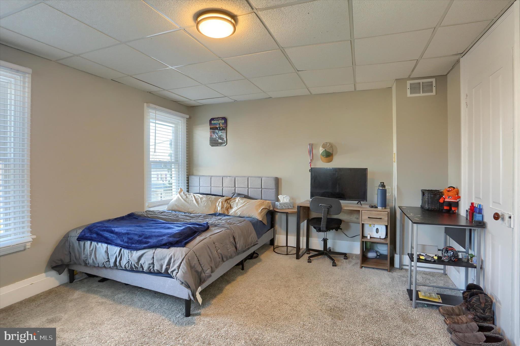 1544 Lafayette Street Lebanon, PA 17042 - Photo 26 of 49 a spacious bedroom with a bed a desk and chair