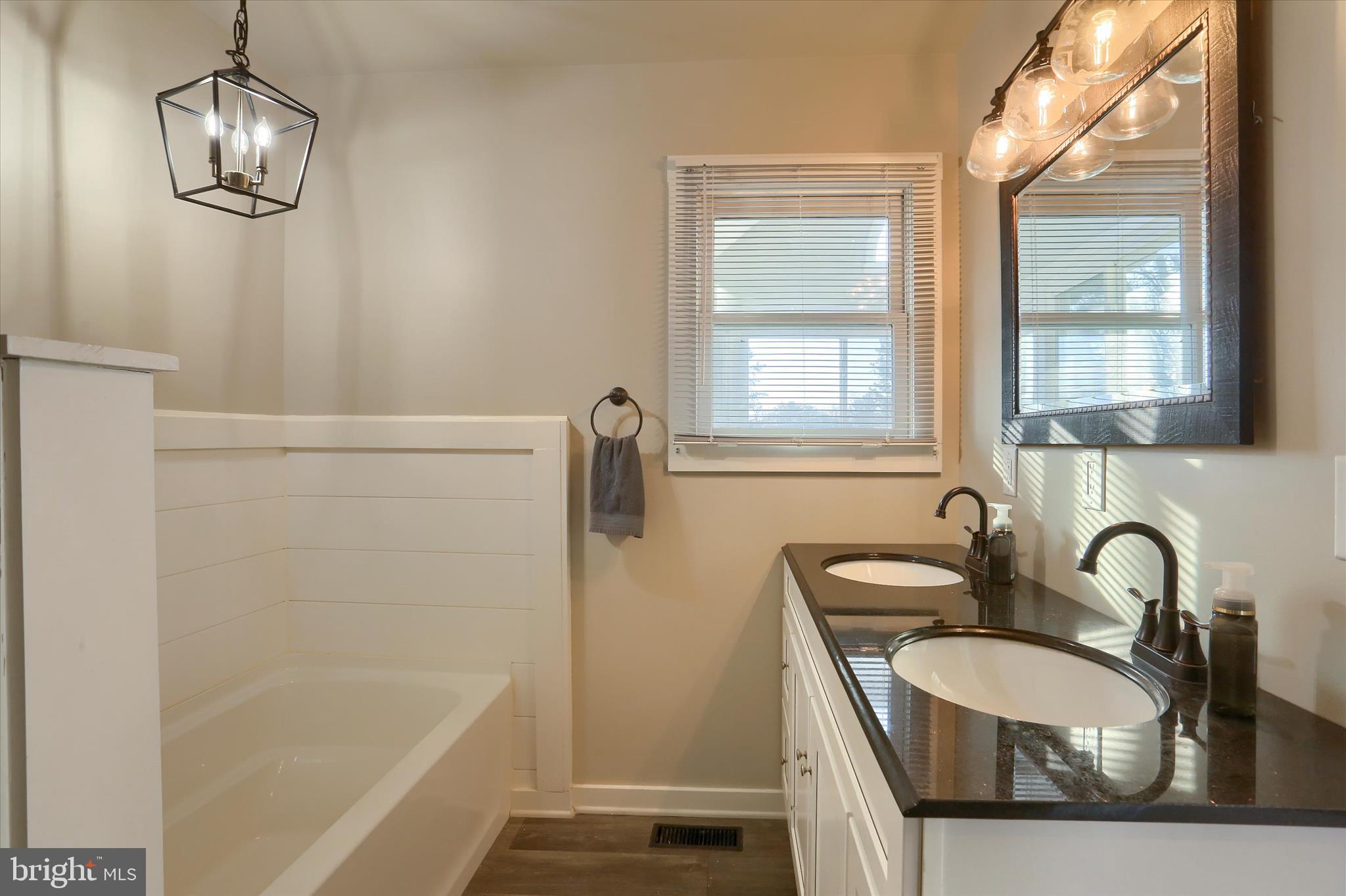 1544 Lafayette Street Lebanon, PA 17042 - Photo 32 of 49 a bathroom with a sink a bathtub and a window