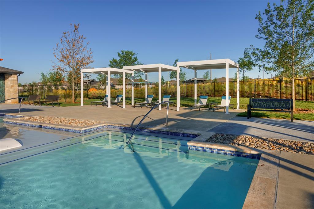 7319 Prairieside Trail Venus, TX 76084 - Photo 9 of 25 swimming pool view with a seating space and a garden