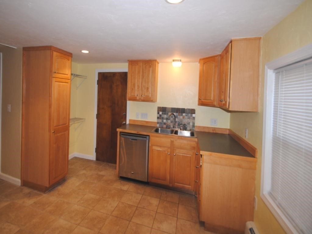 16 Hartness Road, Unit B Sutton, MA 01590 - Photo 3 of 16 a kitchen with stainless steel appliances granite countertop a refrigerator a sink and dishwasher
