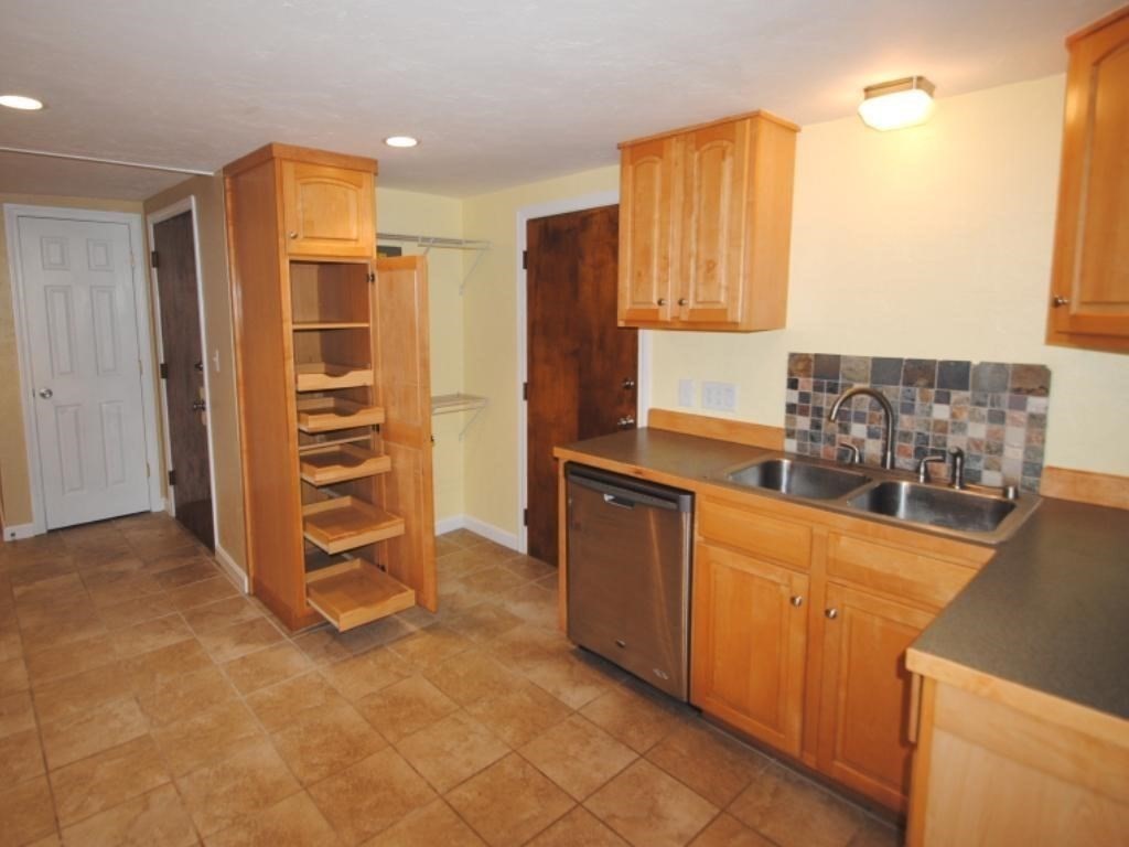 16 Hartness Road, Unit B Sutton, MA 01590 - Photo 4 of 16 a view of a kitchen with furniture and an empty room
